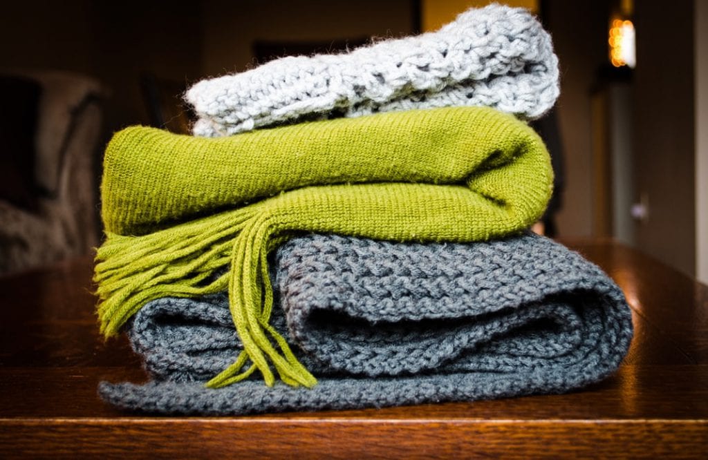 keeping warm clothes in your car can help you in an emergency incident
